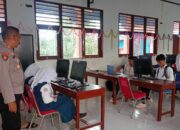 Polsek Woha Laksanakan Pengamanan Ujian Calon Siswa Baru SMA Kemala Taruna Bhayangkara di SMPN I Woha